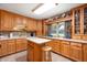 Bright kitchen with light wood cabinets, a central island with stool, and ample counter space at 5081 N 500 W, Fairland, IN 46126