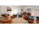Inviting living room featuring warm-toned carpet, comfortable seating, and vintage decor at 5081 N 500 W, Fairland, IN 46126
