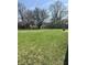 Picture of large green backyard with view of mature trees on a clear day at 5453 David St, Indianapolis, IN 46226