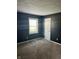 Bedroom featuring gray walls, neutral carpet, closet, and a window at 5453 David St, Indianapolis, IN 46226