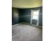 This bedroom features gray walls, neutral carpet, and a window at 5453 David St, Indianapolis, IN 46226
