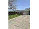 Charming single-story brick home with a well-maintained lawn, driveway, and attached garage at 5453 David St, Indianapolis, IN 46226