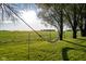 Relaxing hammock hanging from tree in backyard, with views of a lush green field at 6012 N 200 W, Greenfield, IN 46140