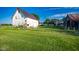 Spacious white barn featuring a metal roof, offering ample storage and rustic charm at 6012 N 200 W, Greenfield, IN 46140