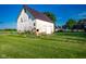 Charming barn with a metal roof, set against a clear blue sky at 6012 N 200 W, Greenfield, IN 46140