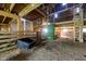 Barn interior featuring a wooden structure, hay floor, loft and natural light at 6012 N 200 W, Greenfield, IN 46140
