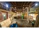 Spacious barn interior with wooden beams, loft area, hay floor and natural light at 6012 N 200 W, Greenfield, IN 46140