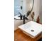 Bathroom sink with modern fixtures and sunflower decorations on vanity at 6012 N 200 W, Greenfield, IN 46140