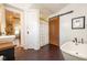 Bathroom features a decorative sliding door and a vintage door at 6012 N 200 W, Greenfield, IN 46140