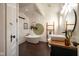 Bright bathroom with vintage door, tub, and decorative ladder storage at 6012 N 200 W, Greenfield, IN 46140