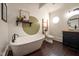 Bathroom featuring a floating tub, ladder storage, and vanity at 6012 N 200 W, Greenfield, IN 46140