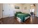 Bedroom featuring wood floors, natural light, and view to other room at 6012 N 200 W, Greenfield, IN 46140