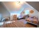 Spacious bedroom with two beds, wood-look flooring, and bright natural light throughout the room at 6012 N 200 W, Greenfield, IN 46140