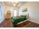 Comfortable bedroom featuring a ceiling fan, dresser, and light from window at 6012 N 200 W, Greenfield, IN 46140