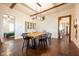 Bright dining room with hardwood floors, wood table, and views into other rooms at 6012 N 200 W, Greenfield, IN 46140