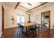 Dining room with hardwood floors, wood table, and modern light fixture at 6012 N 200 W, Greenfield, IN 46140