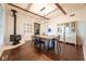 Spacious dining room with wood beams, hardwood floors, and a wood-burning stove at 6012 N 200 W, Greenfield, IN 46140