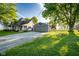 Exterior view of a charming two-story home with a garage and driveway at 6012 N 200 W, Greenfield, IN 46140