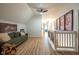 Upstairs hallway with seating and Gathering photos on the wall at 6012 N 200 W, Greenfield, IN 46140