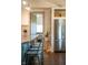 The updated kitchen has stainless steel refrigerator, eat in seating, butcher block countertops, and pot lights at 6012 N 200 W, Greenfield, IN 46140