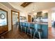 Open concept kitchen features an island with seating, wood countertops, and stainless steel appliances at 6012 N 200 W, Greenfield, IN 46140