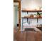 Close-up view of a stainless steel sink and faucet in a kitchen with open shelving at 6012 N 200 W, Greenfield, IN 46140