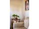 Cozy corner showcasing a side table with plants next to a comfortable sofa and framed photo at 6012 N 200 W, Greenfield, IN 46140