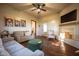 Bright living room with hardwood floors, fireplace, comfortable seating, and framed Gathering portraits on the wall at 6012 N 200 W, Greenfield, IN 46140