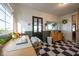 Sunny mud room with checkered flooring, a desk, cabinet and three windows providing lots of natural light at 6012 N 200 W, Greenfield, IN 46140