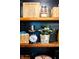 Open pantry shelves stocked with containers, baskets, and decorative items at 6012 N 200 W, Greenfield, IN 46140