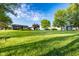 Expansive property view with manicured lawn, featuring a charming barn, home, gazebo and mature trees at 6012 N 200 W, Greenfield, IN 46140
