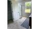 Well-lit bathroom has a shower, storage, and view to the outside at 614 Corbin Way, Avon, IN 46123