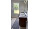 Well-lit bathroom has a double sink vanity, and view to the outside at 614 Corbin Way, Avon, IN 46123