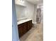 Bathroom boasts a double sink vanity, granite countertops, and modern fixtures at 614 Corbin Way, Avon, IN 46123