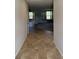 Hallway with ceramic tile floors leading to large windows with natural light at 614 Corbin Way, Avon, IN 46123