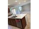 Kitchen island with stainless steel dishwasher and modern sink at 614 Corbin Way, Avon, IN 46123