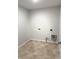 Well-lit laundry room is equipped with modern washer and dryer hookups at 614 Corbin Way, Avon, IN 46123