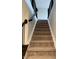 Carpeted staircase with black railings and white trim at 614 Corbin Way, Avon, IN 46123