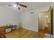 This simply decorated bedroom has wood floors, ceiling fan, and an empty space at 618 Mellowood Dr, Indianapolis, IN 46217