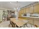 Spacious dining area featuring a vintage chandelier and ample storage cabinets at 618 Mellowood Dr, Indianapolis, IN 46217