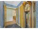 Charming foyer with slate floors, grandfather clock, and multiple doorways at 618 Mellowood Dr, Indianapolis, IN 46217