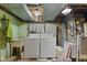 Laundry area with washer, dryer, and utility sink at 618 Mellowood Dr, Indianapolis, IN 46217