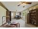 Large Office space, featuring built in shelving and a ceiling fan with light at 618 Mellowood Dr, Indianapolis, IN 46217