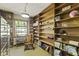 Inviting office with built-in bookshelves, natural light, and a rocking chair at 618 Mellowood Dr, Indianapolis, IN 46217