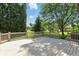 Spacious back deck with railing overlooking the backyard with mature trees at 6183 Whitetail Run, Greenwood, IN 46143