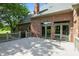 Spacious back deck of a beautiful brick house with sliding glass doors and railing at 6183 Whitetail Run, Greenwood, IN 46143