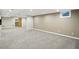Spacious finished basement with neutral carpet, recessed lighting, and a view into a storage room at 6183 Whitetail Run, Greenwood, IN 46143