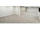 Spacious finished basement area with neutral carpet and walls, offering potential for customization at 6183 Whitetail Run, Greenwood, IN 46143