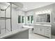 Bright bathroom with a stand-up shower, soaking tub, large vanity and a view outside at 6183 Whitetail Run, Greenwood, IN 46143
