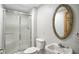 Bathroom with a white toilet, a tiled shower with glass doors, and a vanity with an ornate mirror at 6183 Whitetail Run, Greenwood, IN 46143